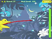 A green chameleon extending its long, sticky tongue to catch a flying bug in the Chameleon Survival game